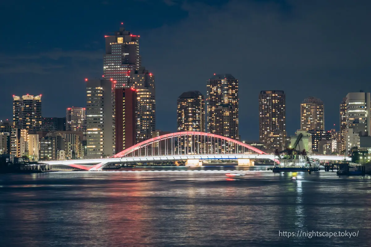 Illuminated Tsukiji Bridge and Tsukishima tower apartment complexes