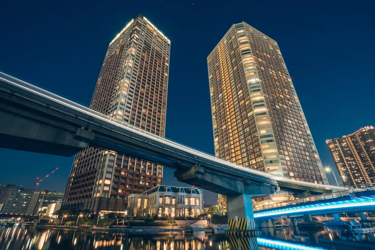 Shibaura Island tower apartments and Tokyo Monorail train