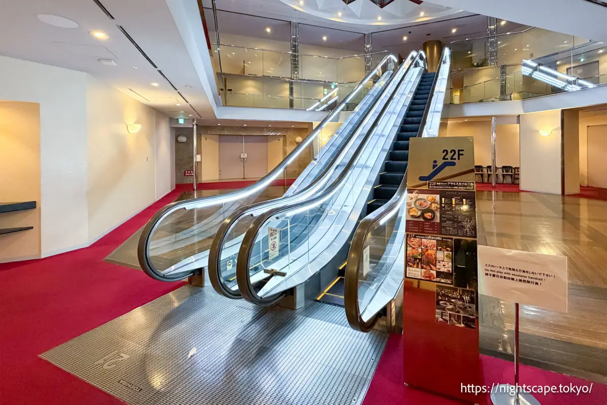 Escalator from 21st floor elevator area to observation lounge
